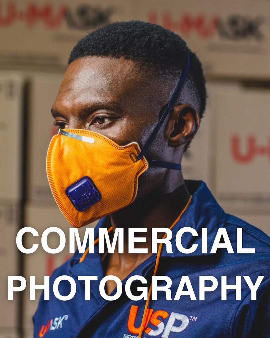 Commercial Photography in Pretoria and Johannesburg โ 21 Commercial photography of a participant wearing a safety mask (PPE) in along a wall of boxes in a factory from one of the projects shot for clients in Pretoria.
