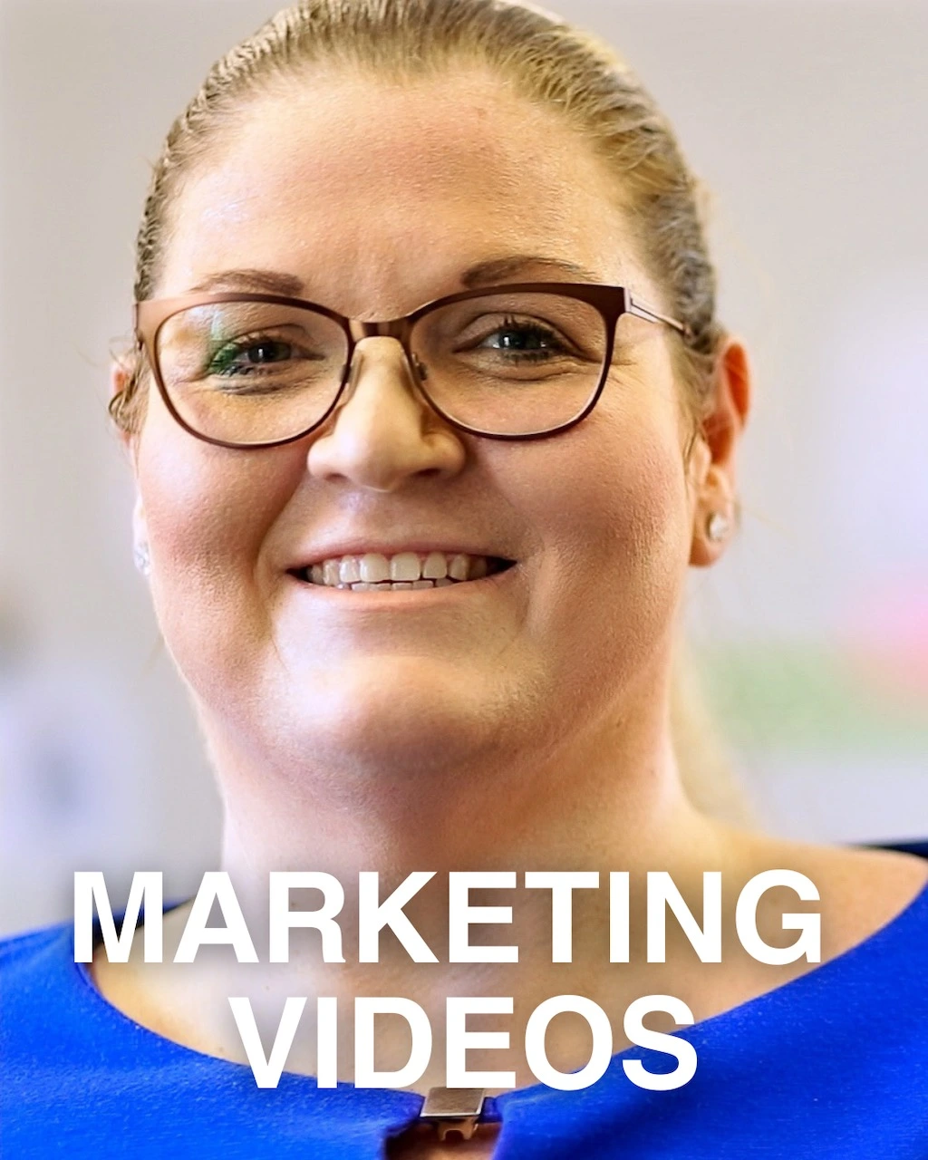 A still image from a smiling woman wearing glasses from a digital marketing video campaign shot for client by Pretoria based Production Company The Chalk Factory.