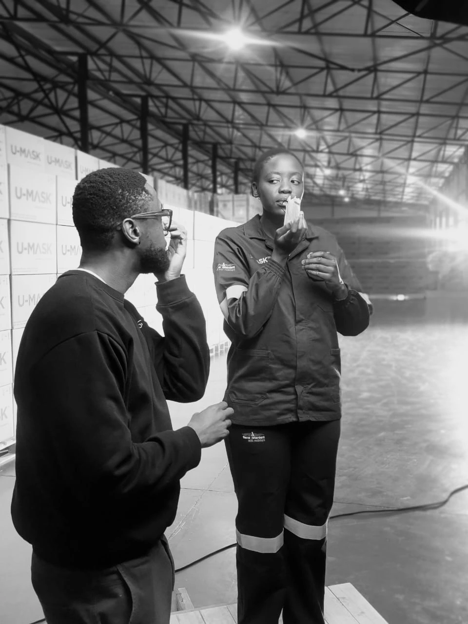 The Chalk Factory Productions – On set with a project. A director from The Chalk Factory Productions giving instructions to a participant on their performance on set, on location at one of their clients factories in Pretoria.