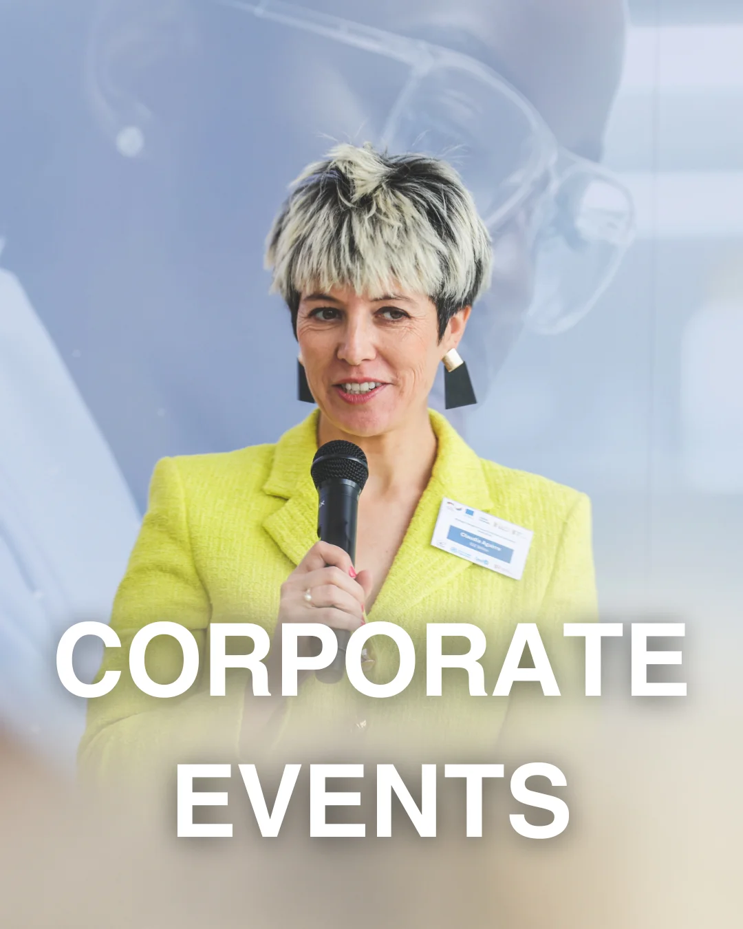 Photograph from a corporate event of a speaker with mic in front of a projection from an event the global organisation was having a launch for their program in Pretoria east.